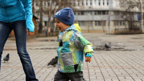 Baby Running After Pigeons