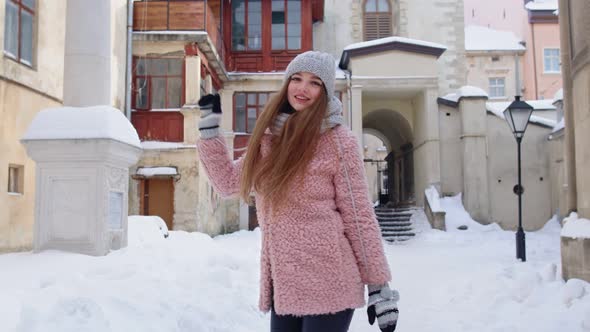 Attractive Young Girl Tourist Dancing Celebrating Smiling During Her Vacation in Old City Center