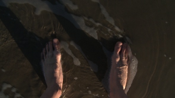 Bare Feet Standing and Walking Through Sea 