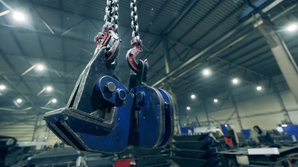 Factory Unit with Clamping Devices Hanging on the Hooks