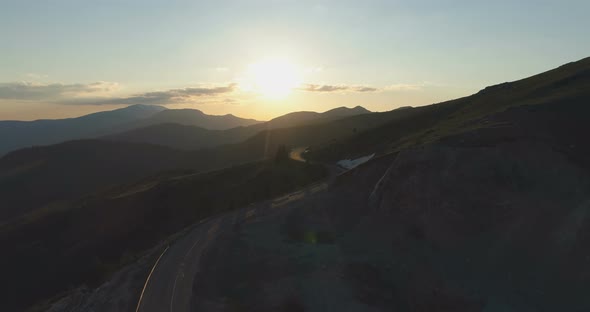 Majestic Sunset Over Lonely Empty Mountain Pass Road