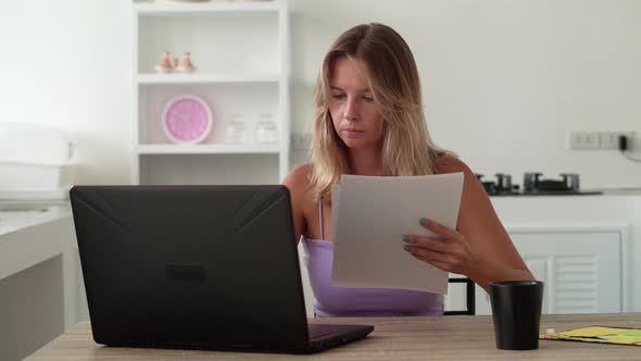 Girl Checks Documents Finds Error Angrily Throws Crumpled Paper Into Laptop