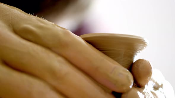 Experienced Potter Creating a Beautiful Clay Vase Using Professional Tools