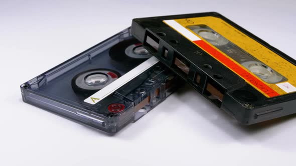 Two Vintage Audio Cassette Rotates on White Background