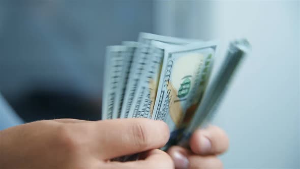 Businessman Hands Counting Cash Hundred Dollars.