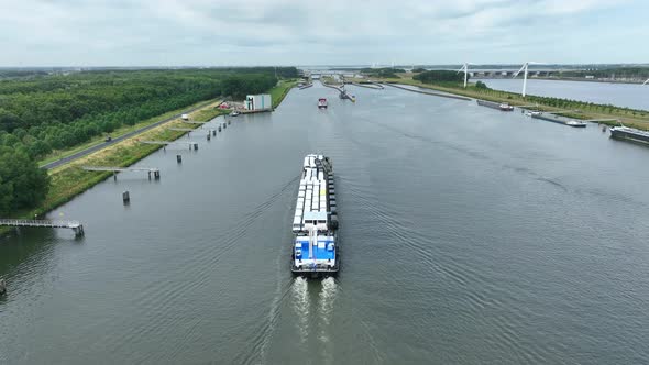Vehicles Transported by Boat Entering the Volkerak Lock in the Netherlands