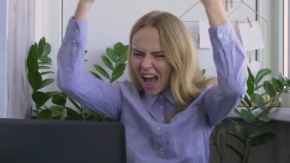 Young Woman Working on a Computer at Home