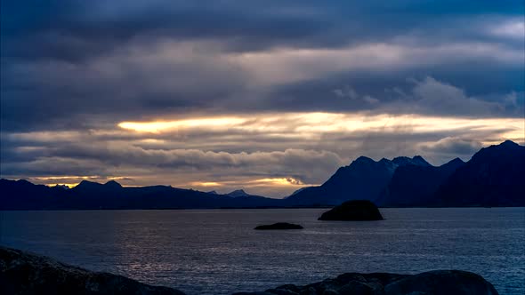 Dramatic sunset over sea and mountains, Norway