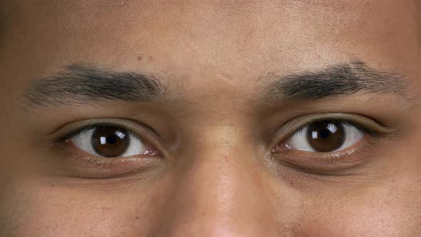 Close Up Brown Eyes of Darkskinned Man