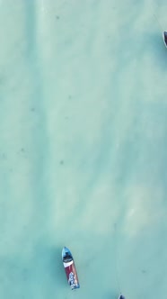 Boat Boats in the Ocean Near the Coast of Zanzibar Tanzania Slow Motion Vertical Video