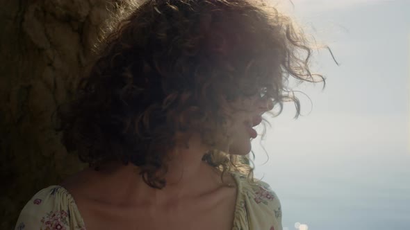 Portrait Curly Girl Shaking Hair Sitting Sand Beach Sunny Day in Sunglasses