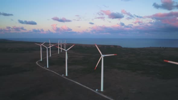 Aerial View of Wind Turbine Generator Blades Rotating on Sea Coast at Sunset Near Kaliakra Cape at