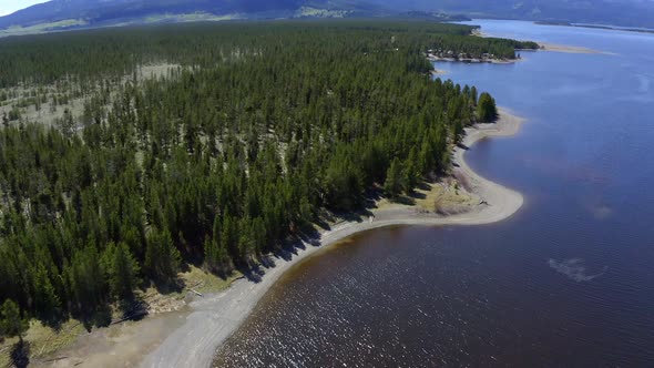 Looking down at shoreline from aerial view along Hebgen Lake