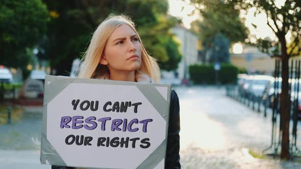 Blonde Woman Protesting Against Human Rights Restriction
