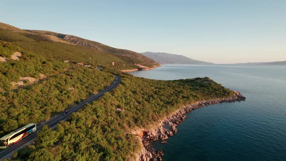 Aerial View Landscape Rocky Coast of Croatia with Curvy Mountain Road at Sunset