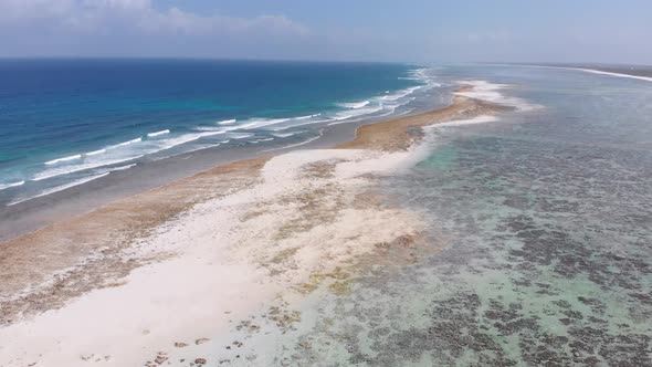 Ocean Coastline and Barrier Reef at Low Tide Zanzibar Matemwe Aerial View