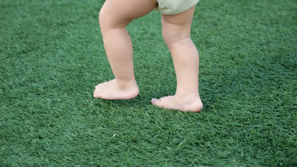 Toddler Learns to Walk on Stadium Running Without Stopping