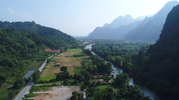 Landscape around the city of Vang Vieng in Laos seen from the sky alt