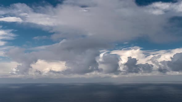 Time Lapse of White Clouds Over the Ocean