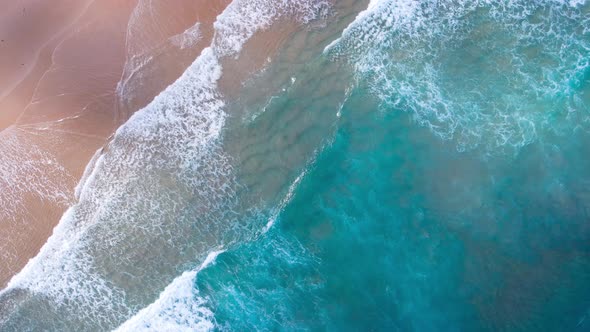 Aerial view beautiful closeup shot beach and seawater on crystal water wave