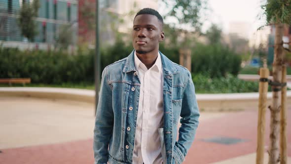 Thoughtful Lost Black Man Looking Around in City