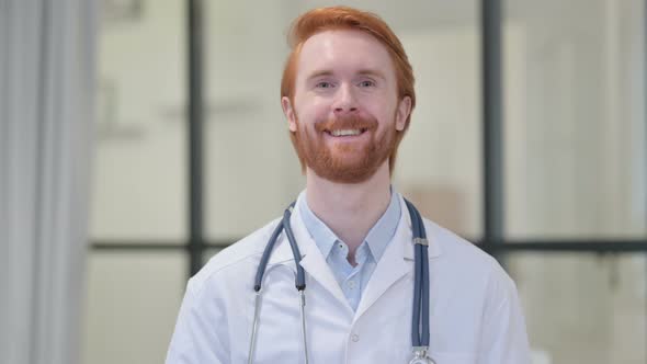 Portrait of Redhead Male Doctor Smiling at Camera 
