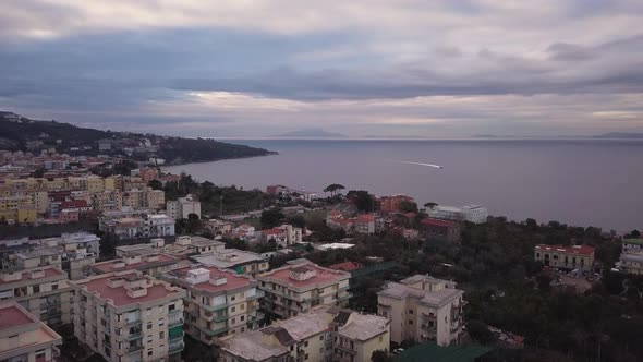 Aerial shot of the coastal town of Sorrento in Italy, a beautiful landscape of houses near the bay o