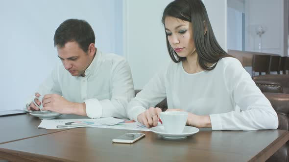 Two Business Partners Finishing Their Coffee and Getting Ready To Work