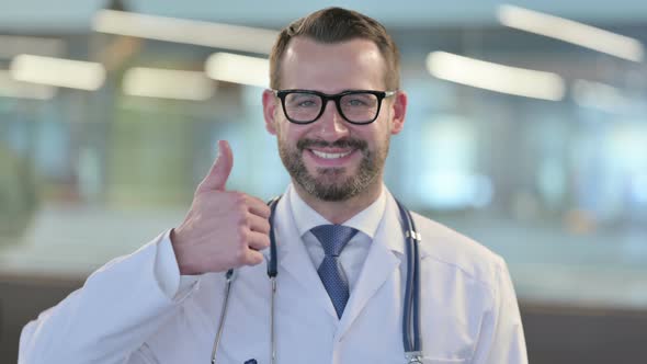 Portrait of Young Male Doctor Showing Thumbs Up Sign