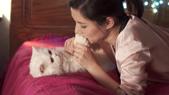 Pregnant Woman is Petting Her Pet