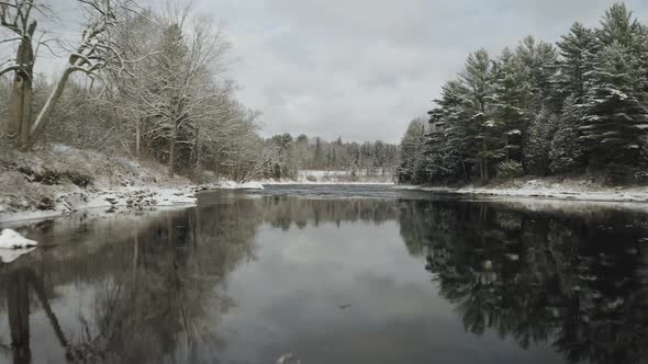 Low level flight over Piscataquis river. Maine. USA. Aerial forward