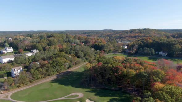 White buildings of Haverhill town and beautiful autumn colors forest landscape