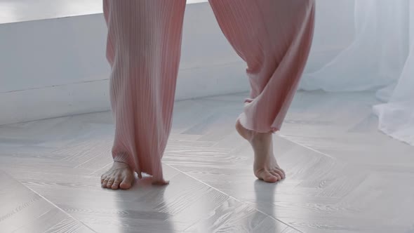 A Young Inspired Woman Dances and Uses Blue Sweater in Her Dance