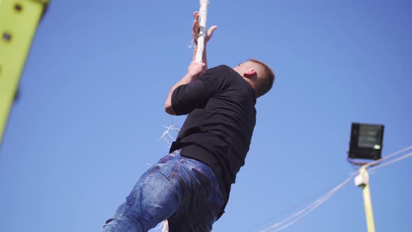 Fitness Rope Climb Exercise in the Street Workout