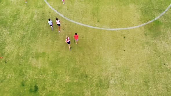 Kids playing football in school playground