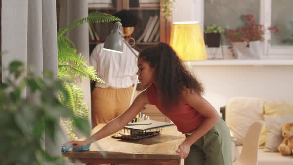 Mom And Daughter Cleaning House Together