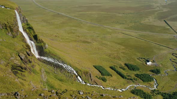 Aerial Drone Footage of Bjarnarfoss Waterfall and River Down the Valley