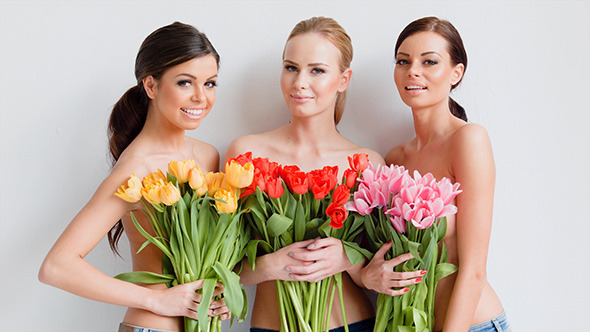 Three Beautiful Women With Fresh Spring Tulips