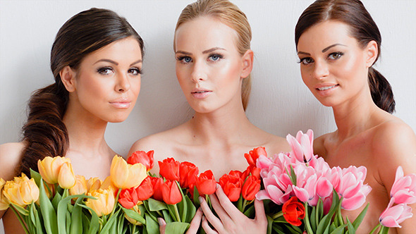 Beautiful Young Women With Tulips