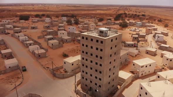 aerial view of big building in palestine near Gaza at the desert.