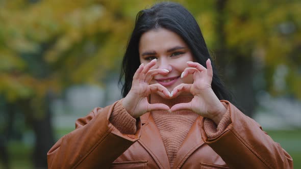 Head Shot Young Happy Overweight Woman Stands Outdoors Smiling Hispanic Joyful Girl Looking Camera