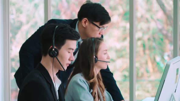 Business People Wearing Headset Working in Office