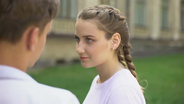 Shy Couple of Teenagers Embracing Each Other, First Love, Tender Relationship