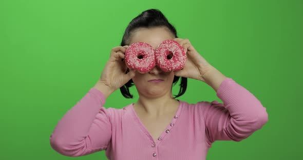 Happy Beautiful Young Girl Posing and Having Fun with Donuts. Chroma Key