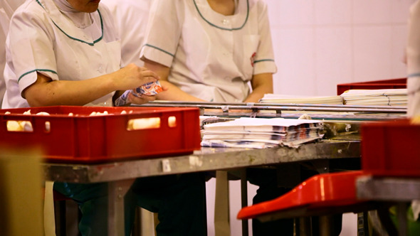 Woman Packing Ice Cream At the Factory