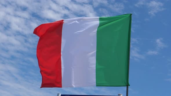 Italian Flag Waving in the Wind in Slow Motion Close Up with Sky Background