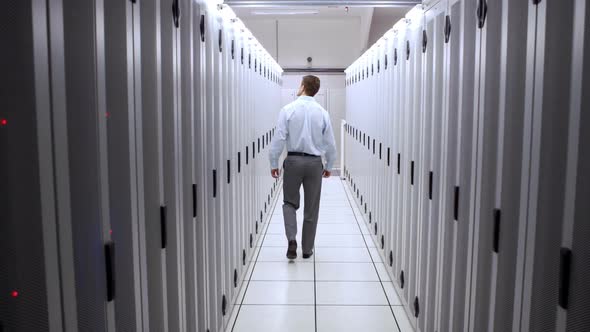 Technician Walking in Server Hallway