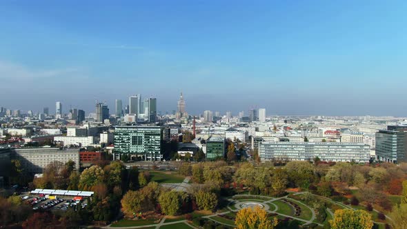 majestic Palace of Science and Culture in Warsaw City center near urban green area, aerial, modern c