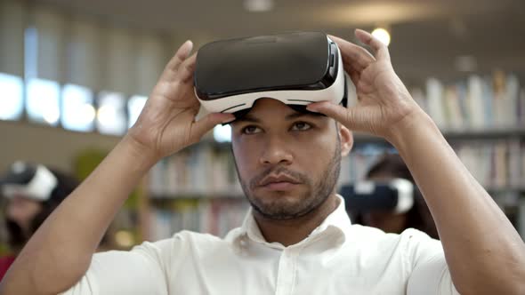 Serious African American Man Experiencing New VR Glasses