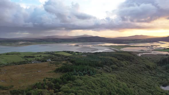 Flying Into the Sunrise Over Ballyiriston in County Donegal - Ireland.